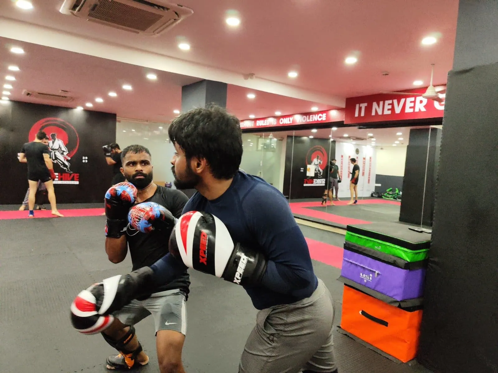 MMA classes in Gurgaon featuring group combat training at StrikeHive Martial Arts Academy