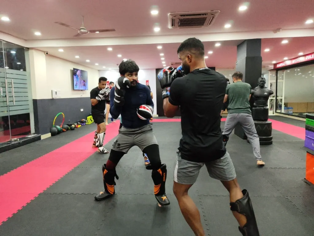 Mixed martial arts classes in Gurgaon with students practicing striking drills at StrikeHive Martial Arts Academy