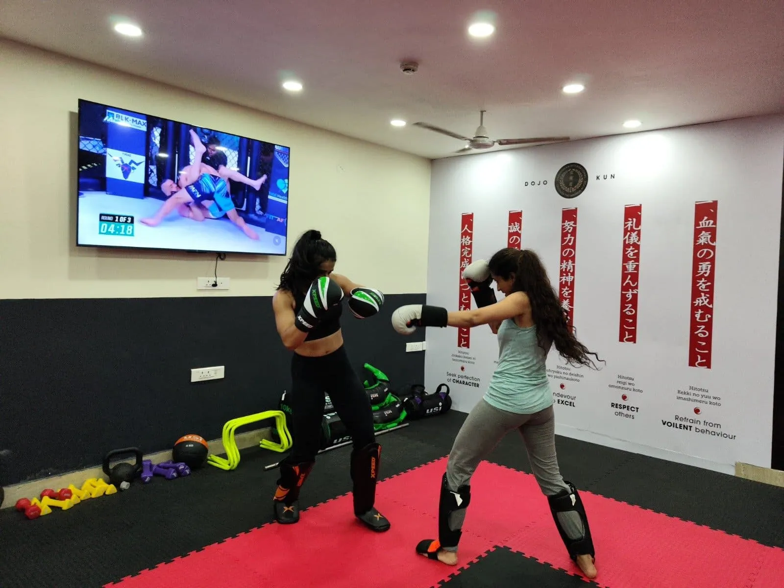 Women's mixed martial arts classes in Gurgaon with boxing practice at StrikeHive Martial Arts Academy